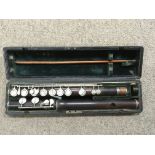 A cased vintage Rundall Carte & Co Ebony flute.