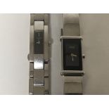 A ladies Gucci chrome watch with a rectangular dia