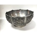 A silver bowl of Chinese influence with various fl