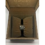 A Gucci ladies dress watch, boxed.