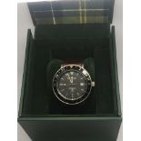 A gentleman's boxed Barbour watch.