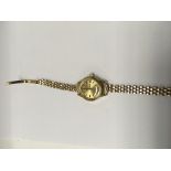 A gold plated ladies wristwatch with 9 ct gold str