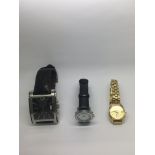 A collection of three watches.