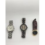 A collection of three watches.