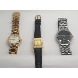 A collection of three watches.