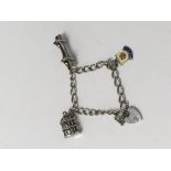 A silver charm bracelet dating approximately 1965/