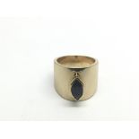 An 18ct gold ring set with a treated sapphire, app