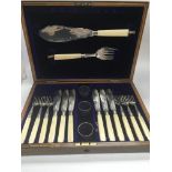 A cased solid silver and ivory handled fish set wi