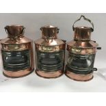 A set of three copper ships Lamps.