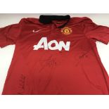 A signed Manchester Utd football shirt including t