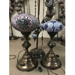 Three Moorish style lamps including standard lamp with graduated suspended chains, with various