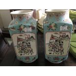 A pair of square shaped Chinese vases decorated wi