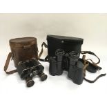 Two pairs of cased binoculars comprising a Lumex and a Russian example.