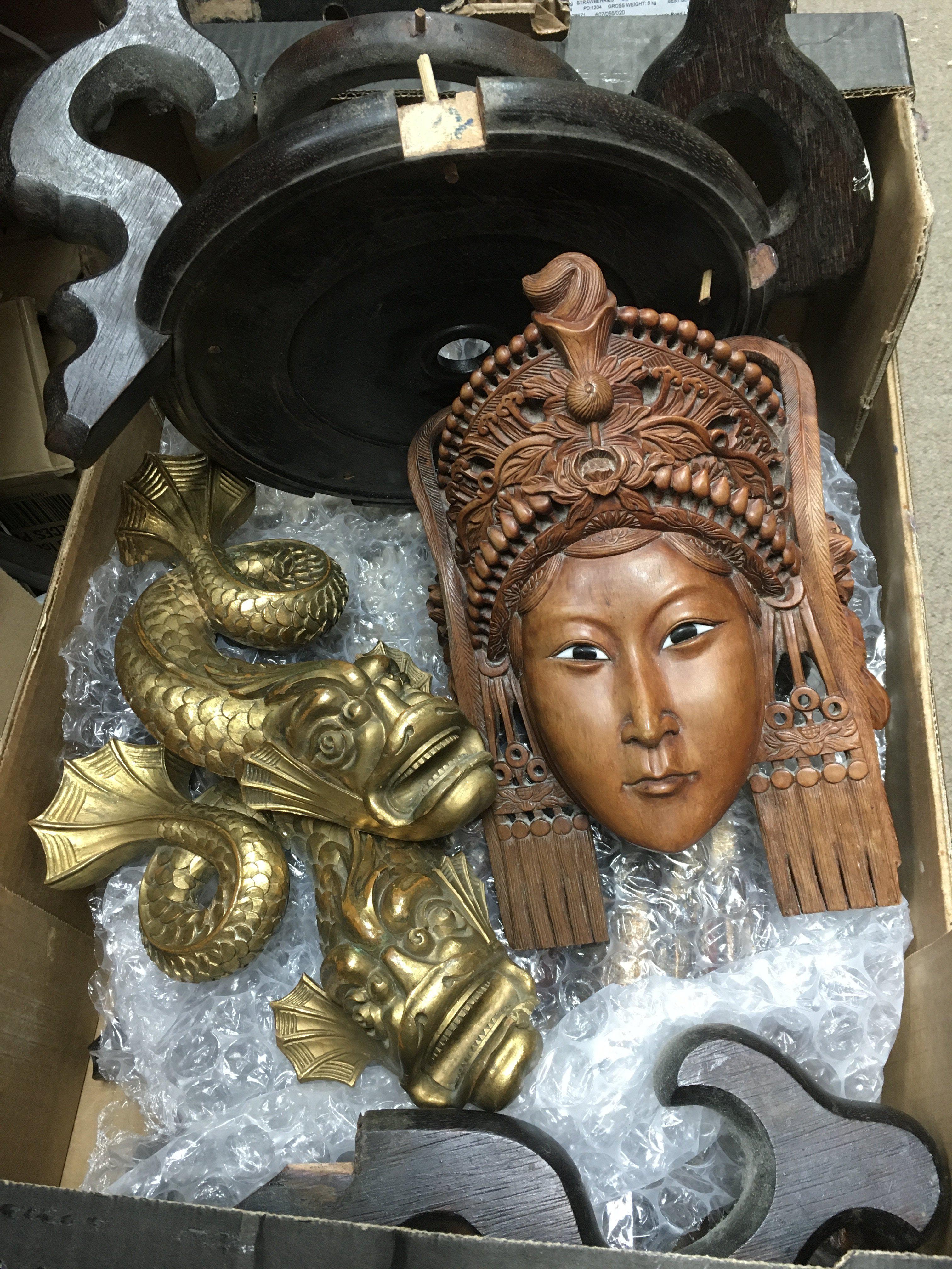 A box of carved Oriental items comprising buddhas,