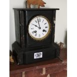 A Victorian black slate mantel clock