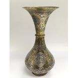 A Persian silver inlaid vase of waisted form, appr