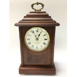 A mahogany Sewills mantle clock with intricate met