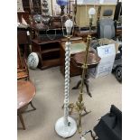 A brass tripod footed standard lamp plus a white painted barley twist design standard lamp