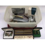 A box of mixed items including pens, military buttons, cigarette case etc.