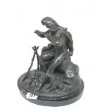 A 19th century Spelter figure of a soldier seated