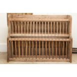 A 19th century pine plate rack. With vertical spin