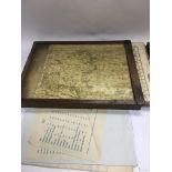 A collection of WW2 era Ordnance Survey maps in a case.