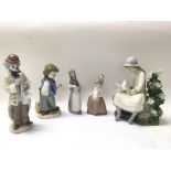 Two Lladro figures, one is numbered 1011 And title