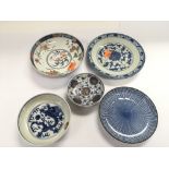 Five Oriental tea bowls and plates, various design