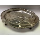 A large silver plated meat tray with 3 graduated s