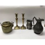 A collection of items: two brass candlesticks, a C