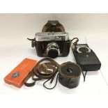 A Voigtlander camera and accessories.