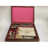 Vintage sewing box containing cotton reels, cards