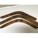 Three old 20th century boomerangs with hand carved