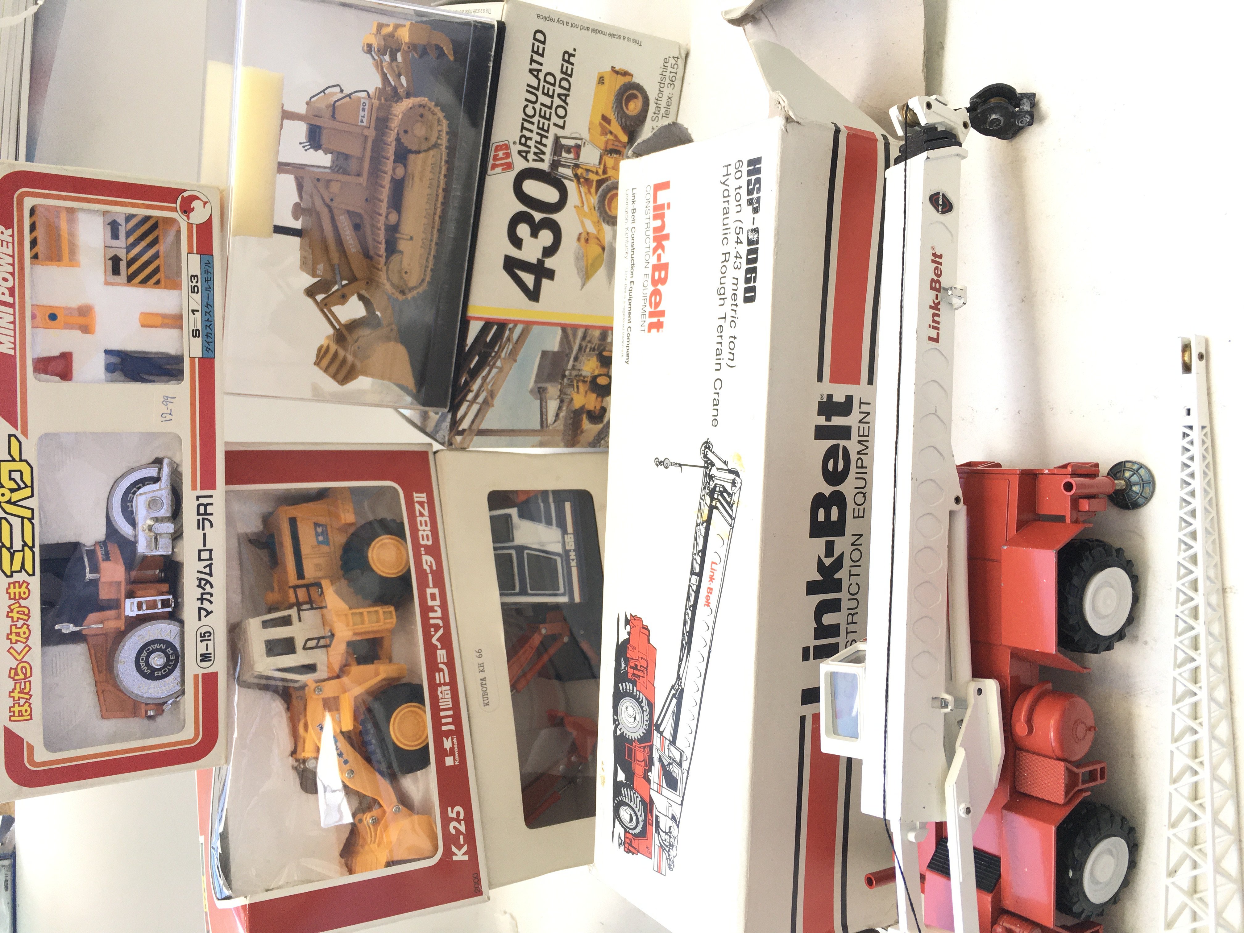 A Collection of Boxed Die cast Vehicles including JCB. link-Belt etc.