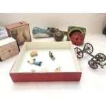 A Box containing a Collection of Vintage Money Boxes. A ship in a light bulb and others.