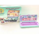 2 Polly Pocket sets (1 boxed) including a Jewel Case Play-Set.
