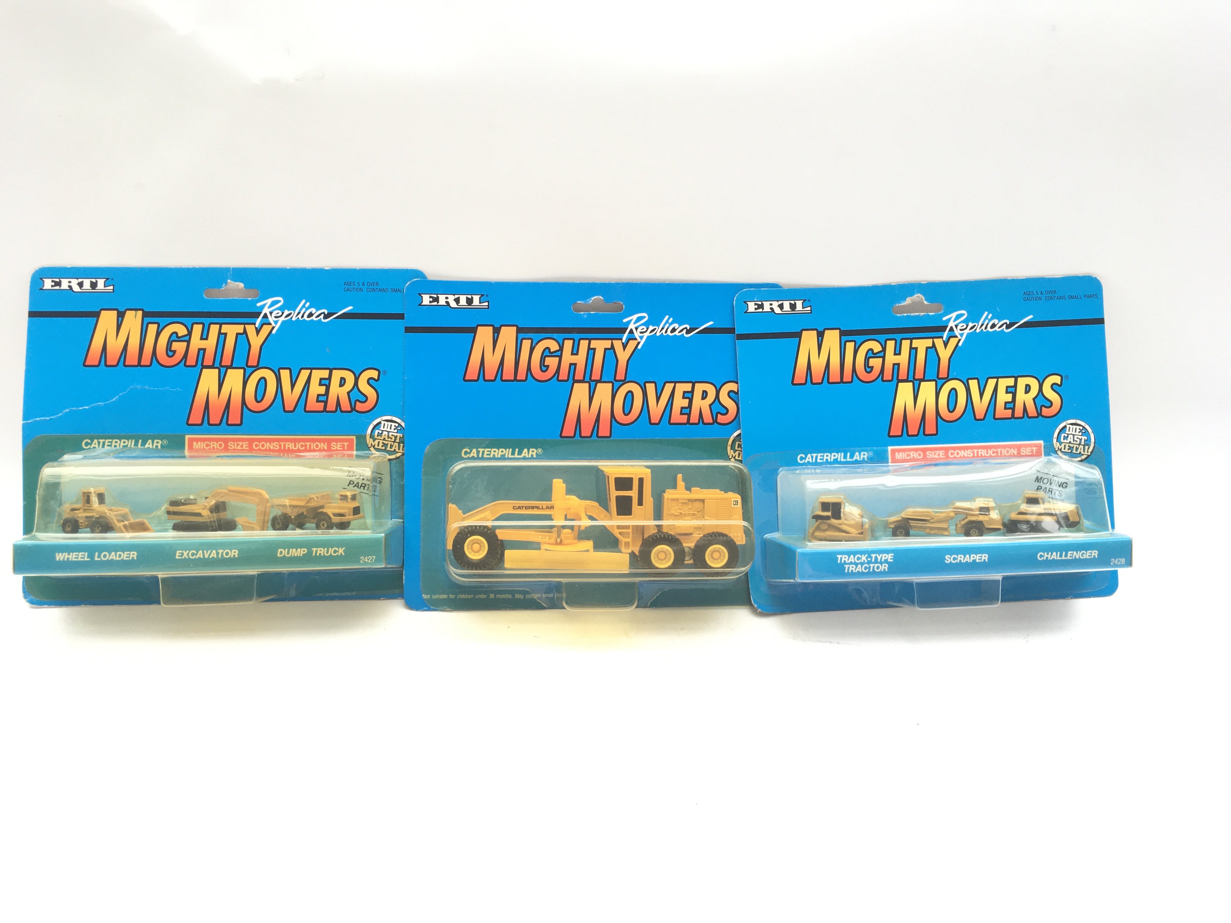 Collection of Die-Cast vehicles. Might Movers. Caterpillar. Boxed/Sealed.