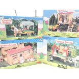 A Collection of Sylvanian Families buildings all boxed. Including Pony and Trap. Treehouse.Caravan