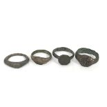 Four bronze roman rings. One is inscribed with lin