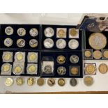 A collection of various commemorative coins.