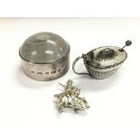 A silver magnifying glass, Sheffield hallmarks, a silver salt pot and a small pig trinket (3).