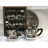 A cabinet of collectors spoons some silver togethe