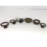 A collection of six roman rings of varying design.