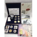 A collection of WW2 coin sets including gold coin