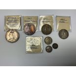 An 1887 full silver coin set to include a Crown, D