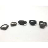 Five bronze Roman rings, four with decorative beze