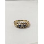 An 18 carat gold sapphire and diamond ring set wit