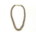 A 15 carat gold double patterned strand watch chai