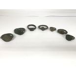 A collection of seven roman rings, some that are b