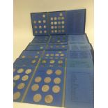 A collection of Great Britain blue coin albums containing shillings from 1901 onwards a few